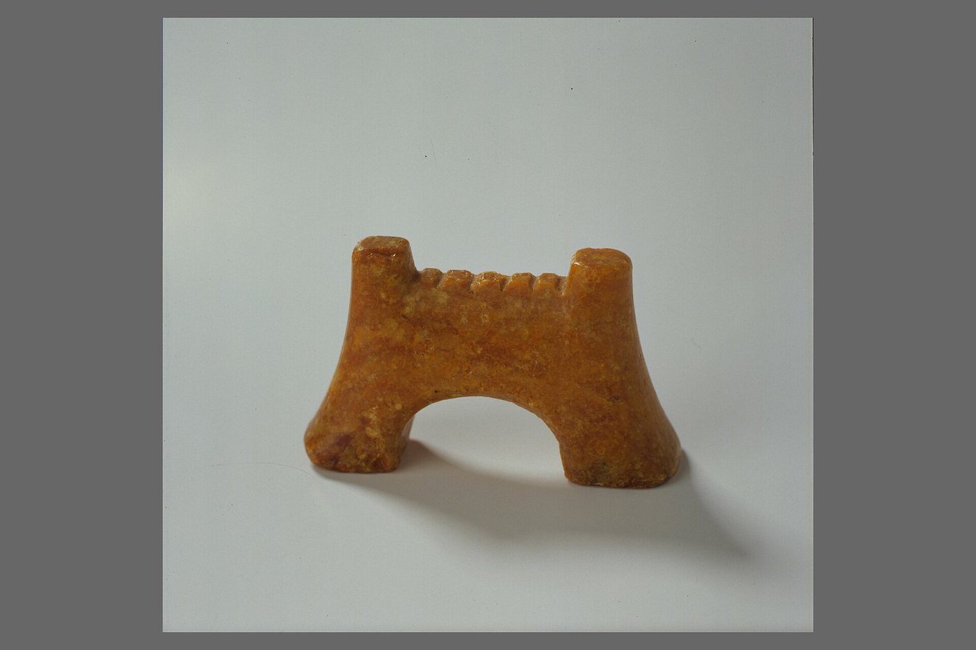 Amber bridge of a lyre from Broa on Gotland