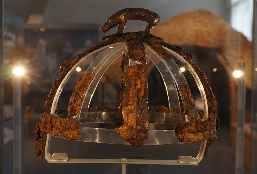 Side view of the Benty Grange helmet, with a boar figure on the crest